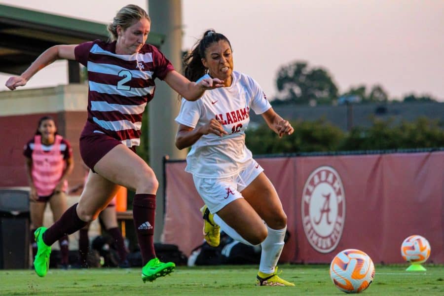 Alabama's Reyna Reyes (16) attempts to make it past her defender in the Crimson Tide's 3-0 victory over the Texas A&M Aggies on Sept. 25 at the Alabama Soccer Stadium in Tuscaloosa, Ala.