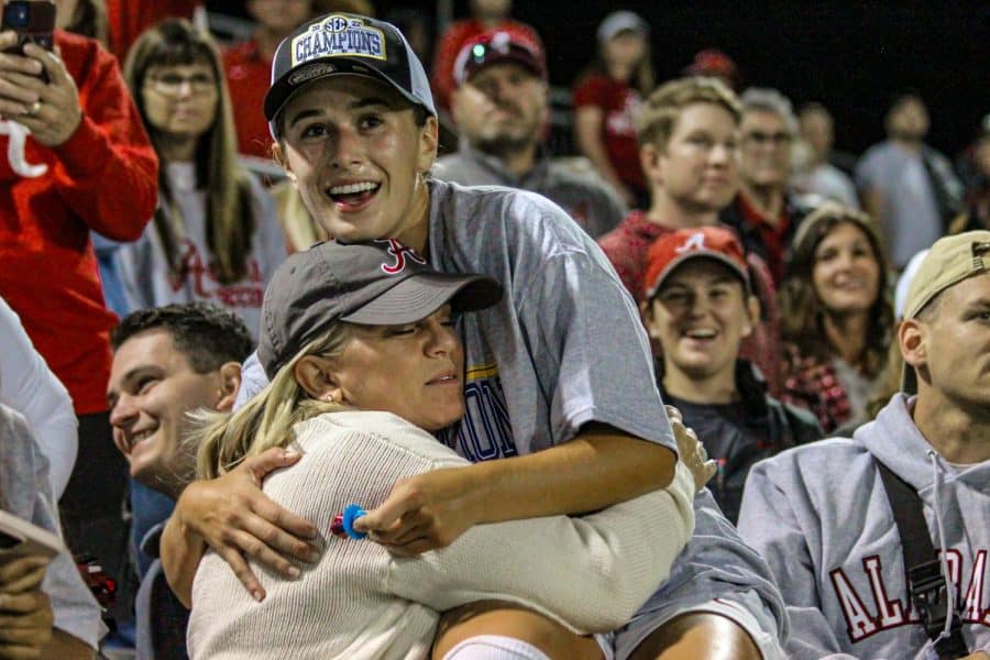 Alabama midfielder Felicia Knox (8) embraces a supporter in the Crimson Tide's 2-0 victory over the Florida Gators on Oct. 23 at the Alabama Soccer Stadium in Tuscaloosa, Ala.