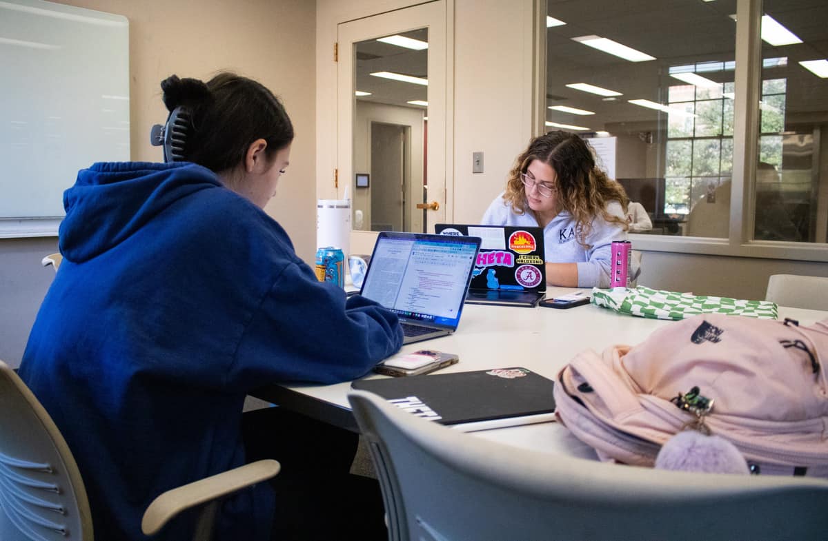 Students studying in Gorgas Library.
