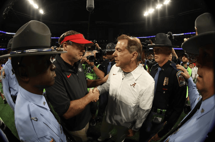 Alabama Head Coach Nick Saban and Kirby Smart shake hands after game against Georgia at Mercedes-Benz Stadium in Atlanta, GA on Saturday, Dec 2, 2023.