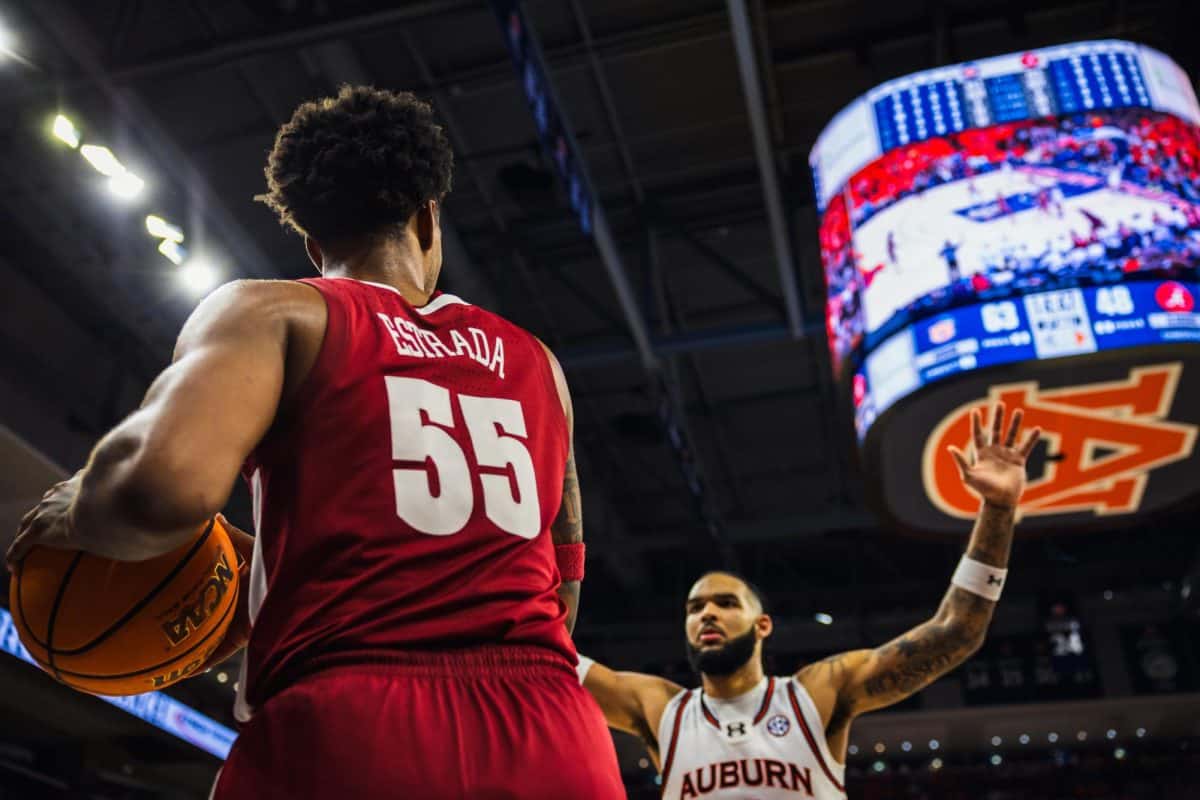 Alabama guard Aaron Estrada (#55) waits to pass the ball in-bounds.
