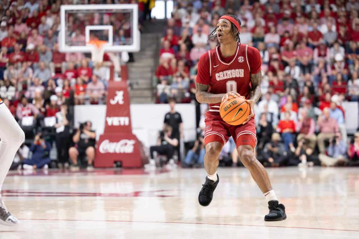 Alabama guard Labaron Philon (#0) attempts a 3-pointer against Auburn.